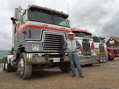Austin Yoder next to international transtar truck