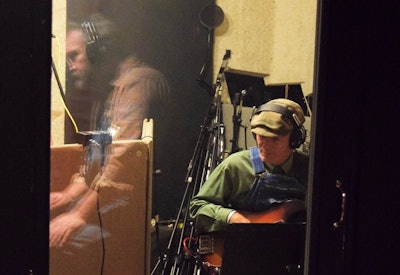 Bassist Terry Richardson (with Marhoefer reflected in the glass).
