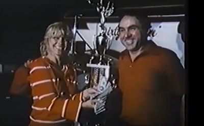 Richard Smith and his wife holding a trophy at diesel drags