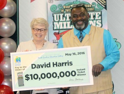 David Harris, a truck driver from North Carolina, won $10 million playing the lottery. With him is Alice Garland, executive director the North Carolina Education Lottery.