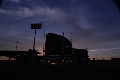 Sunset behind semi-truck
