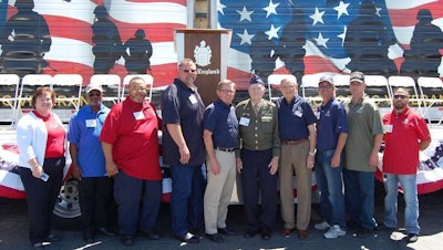 C.R. England added six drivers to its Honored Veterans Fleet and recognized World War II-era veteran Col. Gail S. Halvorsen, “The Berlin Candy Bomber,” as the first recipient of the C.R. England Honored Veteran Award. Pictured left to right: Katie Freisen, Senior Director of Global Distribution and Transportation for The Hersey Company; drivers Mark Evans, Robert St. John, and Brian Walk; Dan England, C.R England Chairman; Halvorsen; Gene England, C.R. England President Emeritus; and drivers Tim Williams, Leland Boyles and Dennis Hallowell. (PRNewsFoto/C.R. England, Inc.)