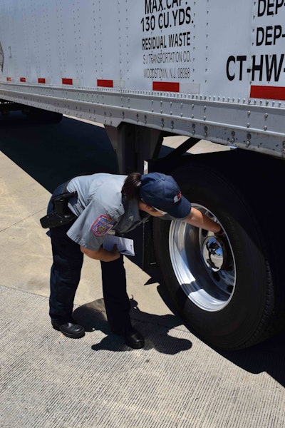 Melanie Whatley conducts a Level II inspection on a truck during CVSA’s Roadcheck. The truck was randomly selected for an inspection from trucks passing through the scales.