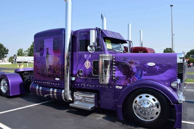 Owner-operator Sean McEndree’s custom Purple Heart Peterbilt, built by DB Customs. McEndree is a Purple Heart medal recipient. He was wounded in Iraq in the early 00s.