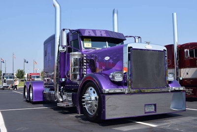 Owner-operator Sean McEndree’s custom Purple Heart Peterbilt, built by DB Customs. McEndree is a Purple Heart medal recipient. He was wounded in Iraq in the early 00s.
