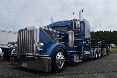 Eric Turner's 2015 Peterbilt glider, powered by a Series 60 Detroit, one of four gliders built by Fitzgerald in his 7-truck car hauling fleet. It's the first show for the Turner family, and Eric's working on a new glider that will pair a new Kenworth Icon 900 with a rebuilt Caterpillar engine.