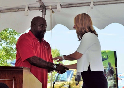 Driver Tyrone McCloud is pictured here just after taking the keys to the Marines-themed tractor he'll now be driving. Detail shots follow.