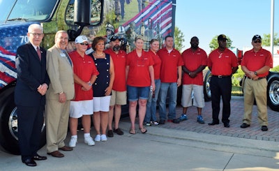 The entire group of honored military veterans/U.S. Xpress drivers with (at left) Tom Bullock and Carl Lambert of the DOD's Employer Support of the Guard and Reserve unit.