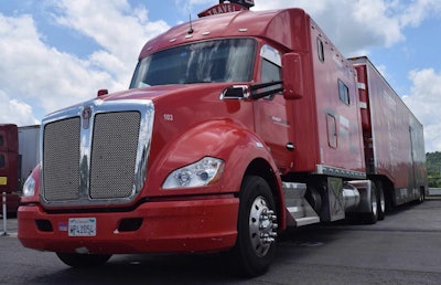 Earl Jackson drives this 2015 Kenworth T680, owned by The Finest Carrier of Laguna Hills, Calif., with 144-inch ARI sleeper, Kentucky moving-van-type trailer outfitted for enclosed car hauling.