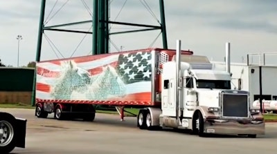 That’s Reed’s Peterbilt pulling Wisconsin-based Jerry Kissinger‘s patriotically decorated reefer trailer. Reed’s known Kissinger for years, he says, part of the reason he, by a path too circuitous to do justice, so to speak, here, got involved with the convoy after showing at the preceding Guilty By Association Truck Show down the road at 4 State Trucks.