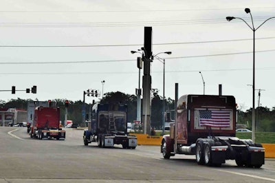Ohio-based Novak’s 2005 379 (right) brought up the rear of the convoy as it rolled out of Joplin.