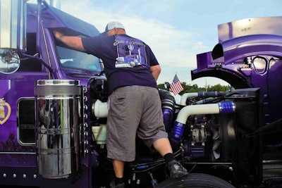 Army veteran and Purple Heart recipient after his military convoy was ambushed in Iraq early this century, owner-operator Sean McEndree today runs in this “Band of Brothers” patriotically decorated custom rig. Stay tuned for more on the 2006 Peterbilt 379, which he piloted in the “Stars, Stripes and White Lines” convoy, and custom work by DB Kustom Trucks, among other suppliers