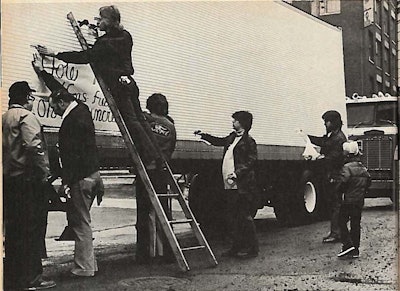 This photo, from the July 1979 issue of Overdrive shows truckers affixing a banner to an ITA member’s trailer.