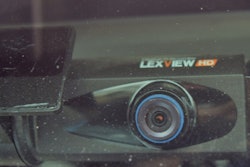 The forward-facing camera, mounted just left of center at the top of the windshield, in independent Howard Salmon’s 1999 KW.