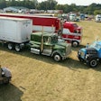 semi trucks in a field