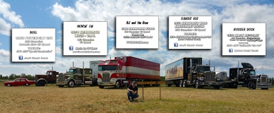 five semi trucks in a field