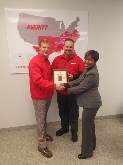 Jennifer Wade (right), of the Missouri Division of Workplace Development, presents the Flag of Freedom award to Averitt Express’ St. Louis service center director Scot Hollocher (left) and driving associate Joseph Ailshie. Ailshie served in the United States Marine Corps during operations Desert Shield and Desert Storm.
