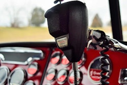 CB mic in a semi-truck with a red dash
