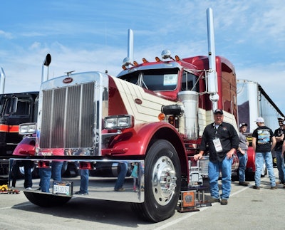 Bill Warner Jr. celebrated with his 1987 Peterbilt 359 and Mac frameless dump combo after the awards program in the PKY championship Saturday. Warner is owner of the small fleet that bears his name in Circleville, W.Va. The truck also took home a Best Use of Chrome award in the combo category. Catch a video run through the truck via this link.