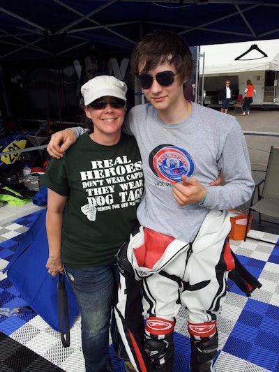 Christine Treviranus with her son after he took first place at the Brainerd International Raceway, where she volunteers once a month.