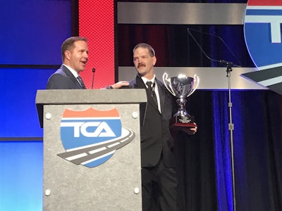 Daniel Sieczkarski (right) of Melton Truck Lines was named the 2016 Highway Angel of the Year. He was presented the award Monday by Lance Platt of EpicVue, Highway Angel sponsor.