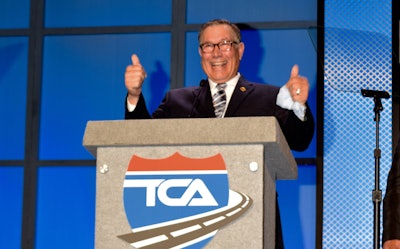 Gary Buchs accepts his award at the Truckload Carriers Association annual convention.