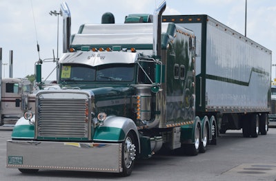 Daniel and Phyllis Snow's 1996 Freightliner Classic XL. The truck has 'In God We Truck' in a stripe...