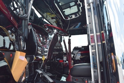 The dark red interior detailing of Kyle Cousins' 2008 Kenworth W900 matches with the marbled...