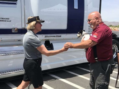 Western Star president Kelley Platt presents OOIDA rep John Osborn with the keys to his new truck.