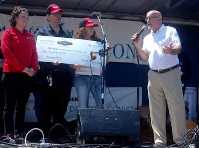 RoadPro’s Gina Bonafede, Tom Kyrk and Joanne Fatta present $20,000 to Make-A-Wish President and CEO Dennis Heron.
