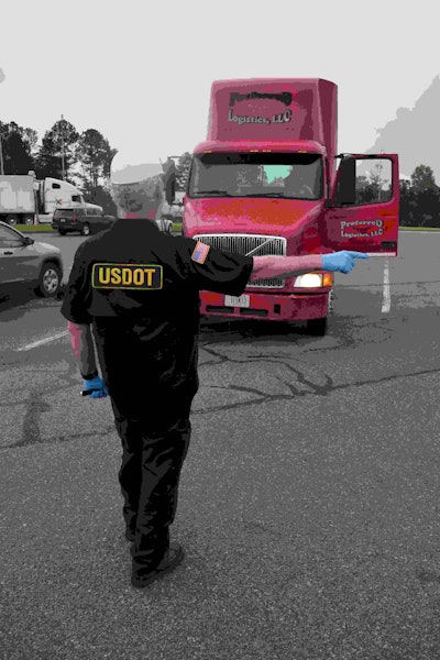 FMCSA agent Tim McCadden, who normally works on carrier compliance, goes through a Level 1 inspection with Rick Henley, driving for Preferred Logistics of Barnesville, Georgia.