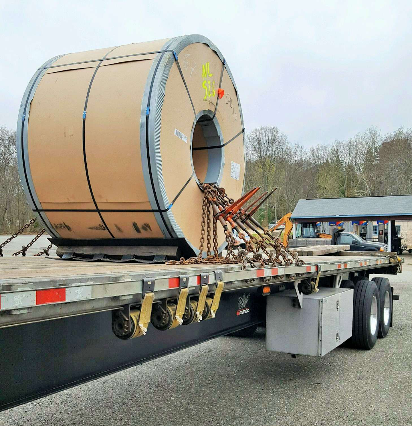 “When the coils get big, you don’t chain them to the trailer,” Bielucki wrote with this one. Rather, “you chain the trailer to the coil. Notice the bow in the side rail near the chains!”