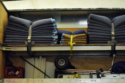 Huggins’ necessary equipment stored in the box. One thing you don’t see in the photo: a pallet jack below the frame.