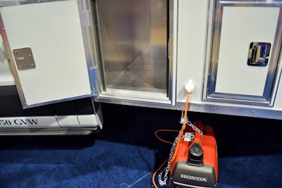 McNeal built custom compartments on the driver side under the sleeper for a generator, shown, as well as a spare gas can.