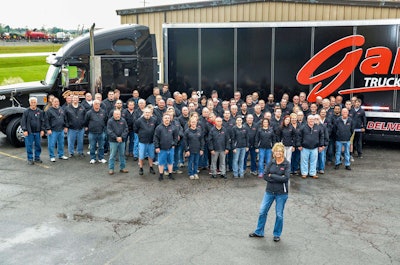 Garner, front, with Garner Trucking employees.