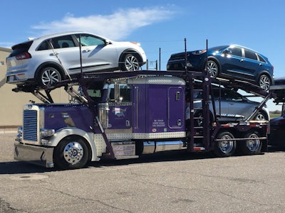 The Federal Highway Administration is considering expanding the definition of auto haulers to include high-mount tractor-trailers that are not able to haul vehicles on the tractor itself.