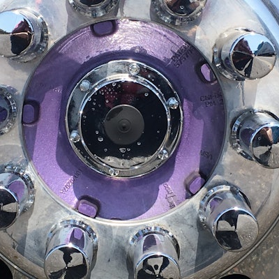 The stainless steel wheel hubs of the truck are also painted purple to match the body of the...