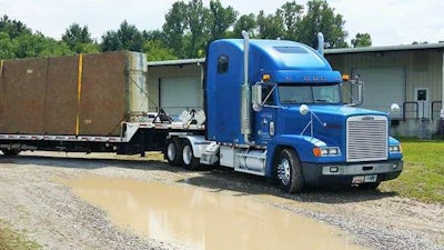 Owner-operator Ater hauls in this 2000 Freightliner FLD, powered by a Series 60 Detroit. As shown in the picture, his typical trailer is a step deck, those for relief shuttle operations he’s hauling pre-loaded trailers.