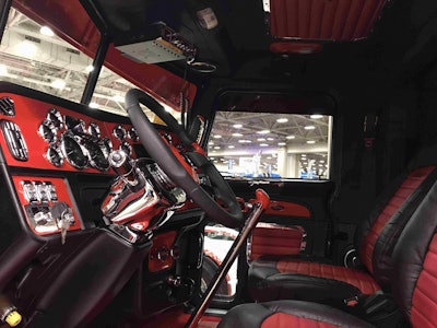 The truck’s interior was done by 4 State Trucks in Joplin, Mo. It features custom “Coke Red” dash panels, a red shifter knob, black and red steering wheel and seats and more.