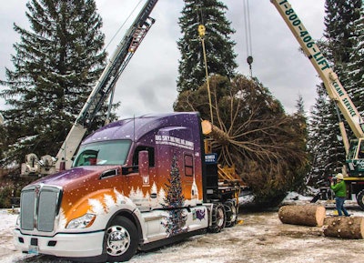 The 53rd U.S. Capitol Christmas Tree is loaded onto a custom-wrapped Kenworth T680 Advantage.