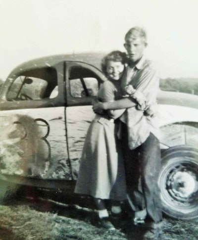 Carl and Sandra Jean are pictured here next to a racer Carl drove as a very young man around local tracks. Rick said his dad’s racing strategy was one that featured a certain kind of ingenuity. “The other guys running with the big hot-rod motors — much faster cars than his — a lot of times they’d be bumping each other and fighting. He’d be behind them,” in a car that “had a radiator and a 120-pound grease drum that had water in it for extra cooling capacity for the car. The big guys would be jostling for first place – they’d get hot and he’d go right by them.”