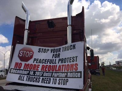 Part of the demonstrators’ message was directed to others in the trucking industry, urging a shutdown in solidarity. This picture was taken by Mandi Jo Pinheiro, among the owner-operators on hand for the event with her team-hauling husband, independent owner-operator William Pinheiro, both of Twin Falls, Idaho.