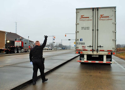 Sergeant Jason Morris of the Kentucky State Police beginning an inspection of local-route Tennessee Contract Carriers driver Robert Huff of Chestnut Mountain, Tenn., who runs under the short-haul exception to the hours of service, likewise the ELD mandate.