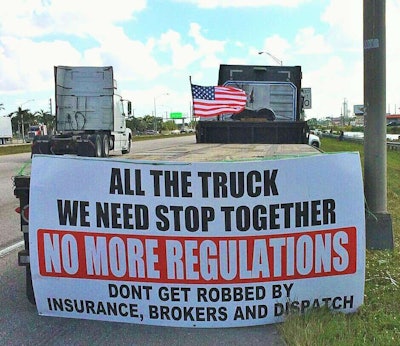 More messaging on the back of a trailer at the protest site near Miami. Photo by Mandi Jo Pinheiro.