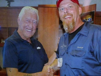 OOIDA boss Jim Johnston, who has passed at age 78, is pictured here with owner-operator George Parker.