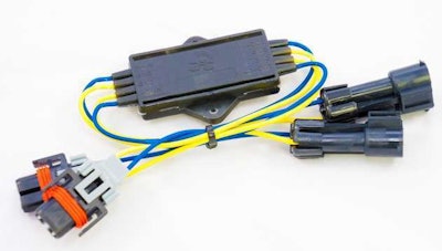 The Lighting Bug tech is shown here — “you can fit three or four of them in your pocket,” Boykin says, to give you an idea of size. The device plugs directly into your headlight assembly on one end, electrical connection coming from the truck on the other, and powers on with the truck. It works with most any headlight assembly, he adds, from both traditional halogen to newer LED assemblies.