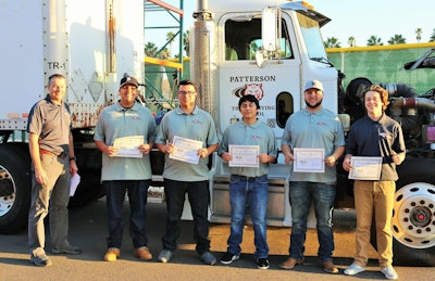 Dave Dein and students in Patterson High School commercial trucking course for seniors