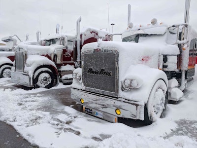 About eight inches of snow fell on Louisville as show trucks lined the lot at the Mid-America Trucking Show.