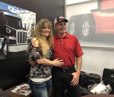 Rick McClerkin, right, won a Model 567 Heritage in Peterbilt’s SuperFan contest. He was accompanied to the announcement by his fiance, Kathy Cantaloube.