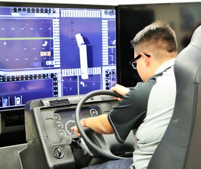 A student working with one of the two Advanced Training Systems driving simulators in use at Patterson High School in the program.